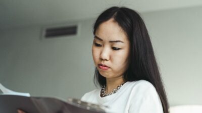 A woman looking over paperwork